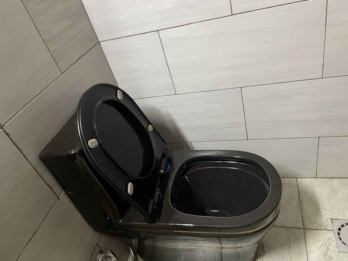 Ensuite bathroom with a black toilet suite