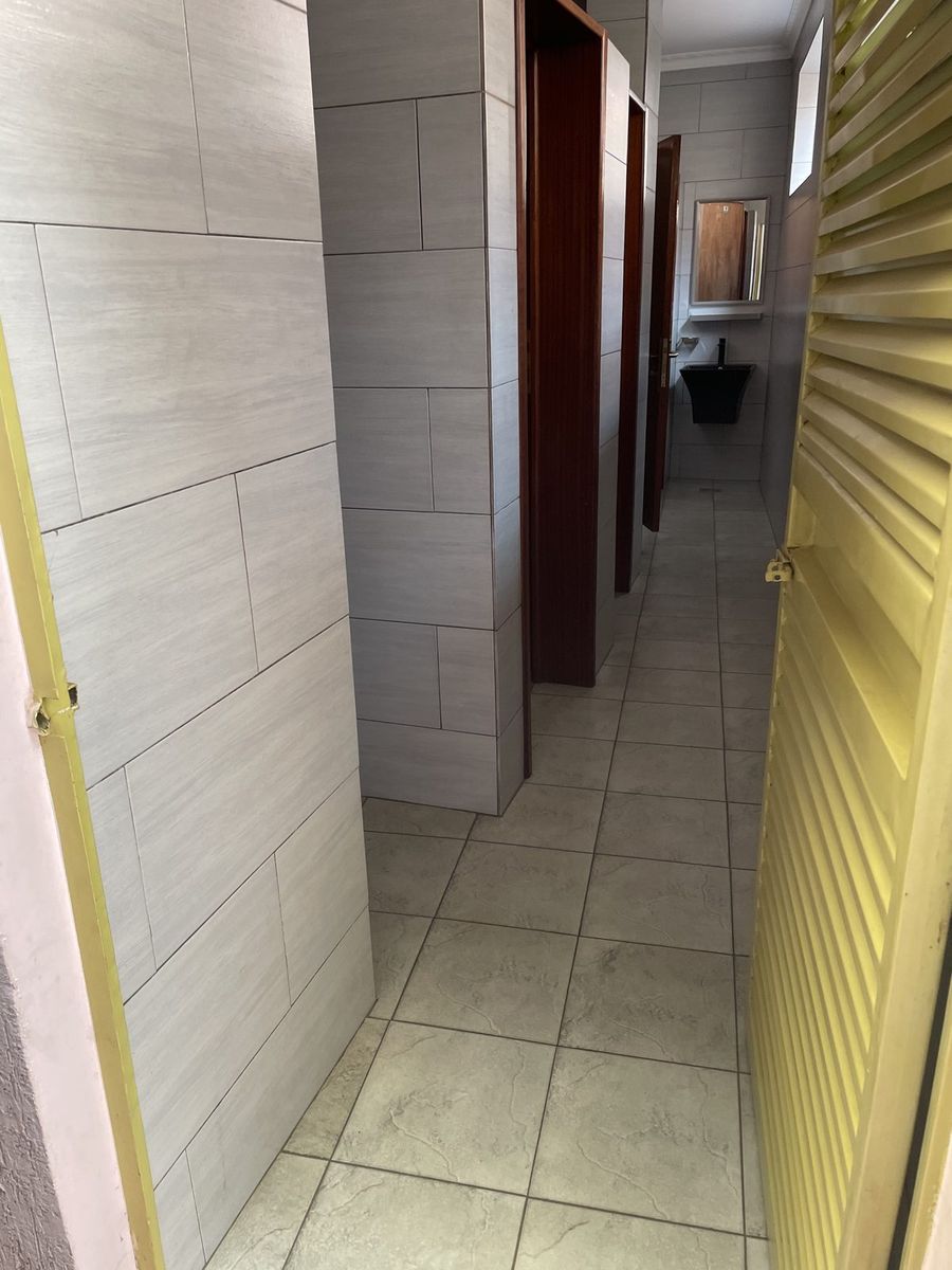 Tiled passage leading through to the guest rooms