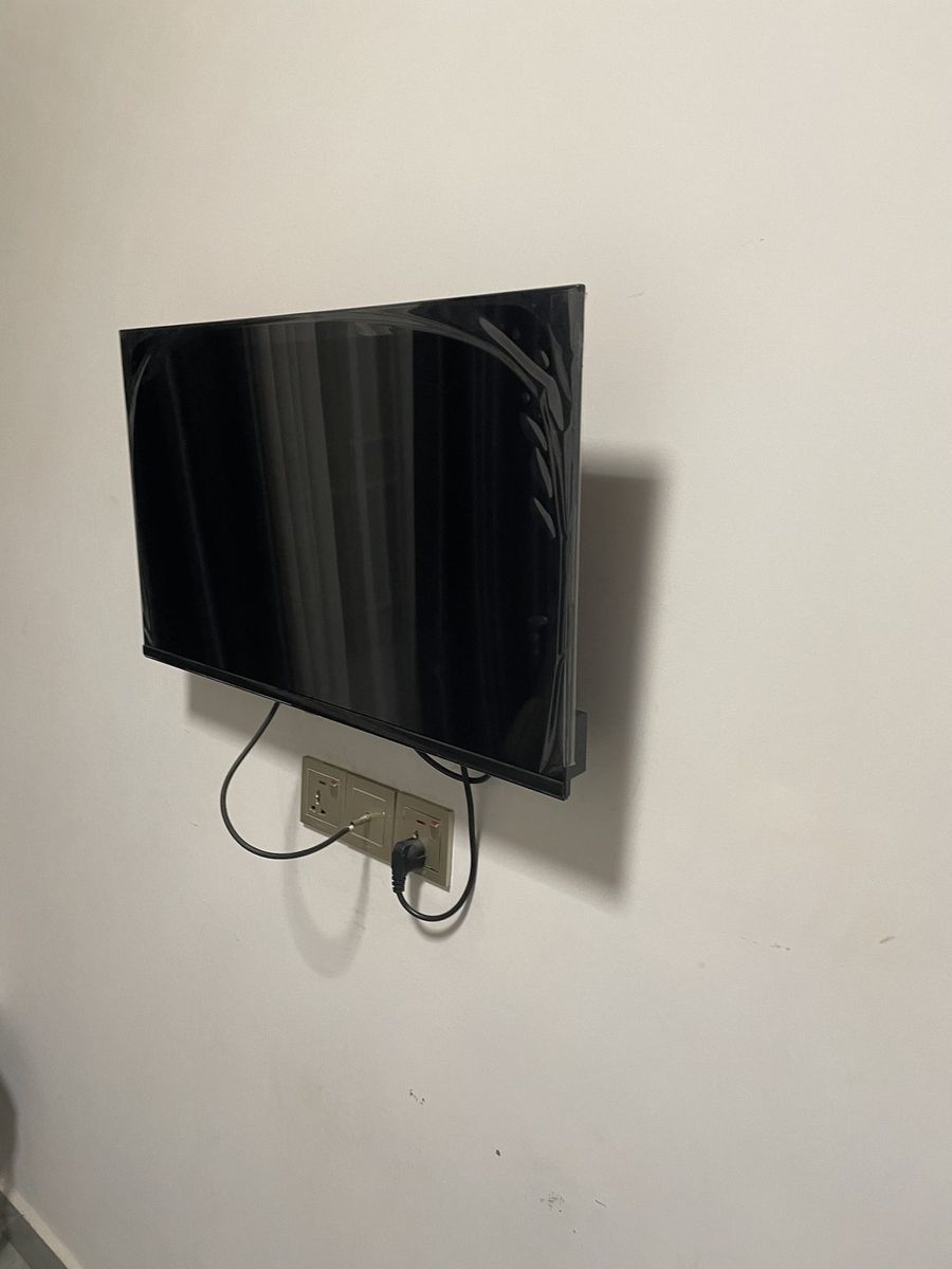 Wall-mounted flat-screen television in a guest room