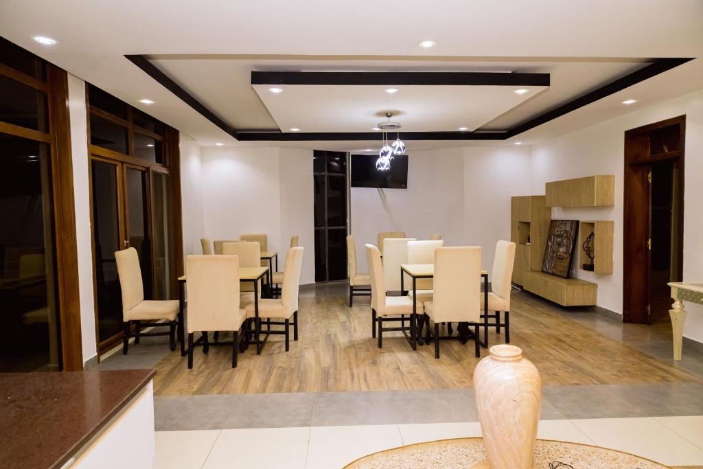 Bright restaurant seating area with wooden floors