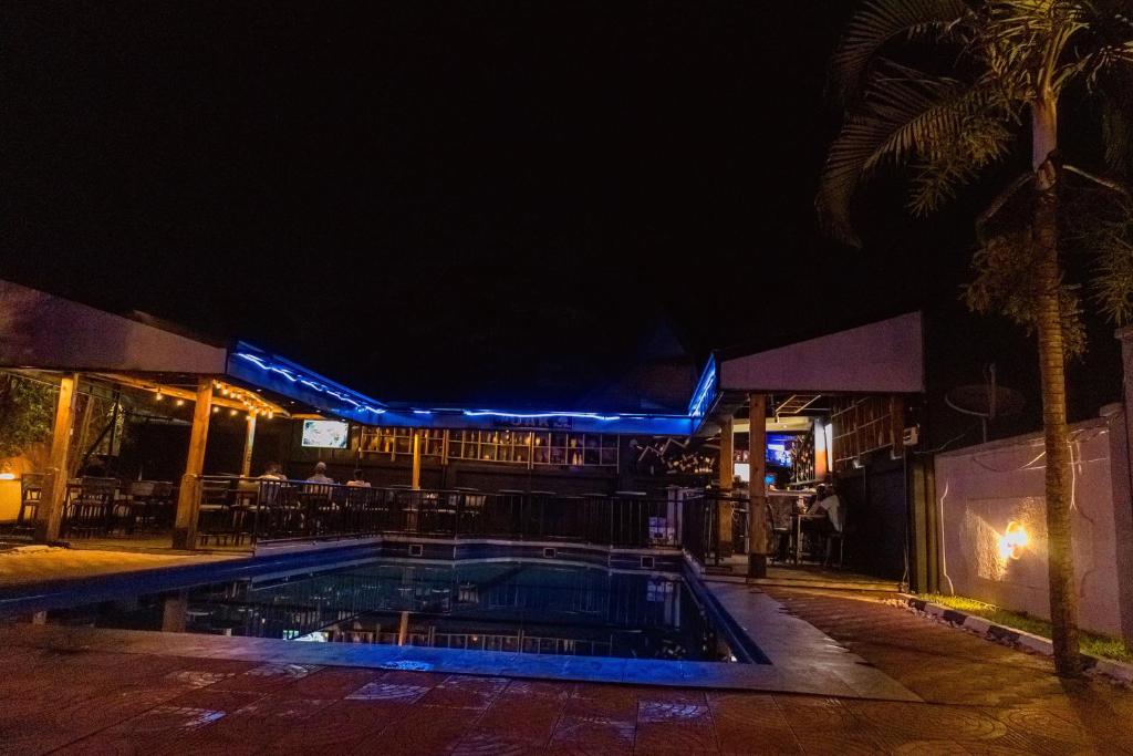Poolside terrace glowing blue after dark