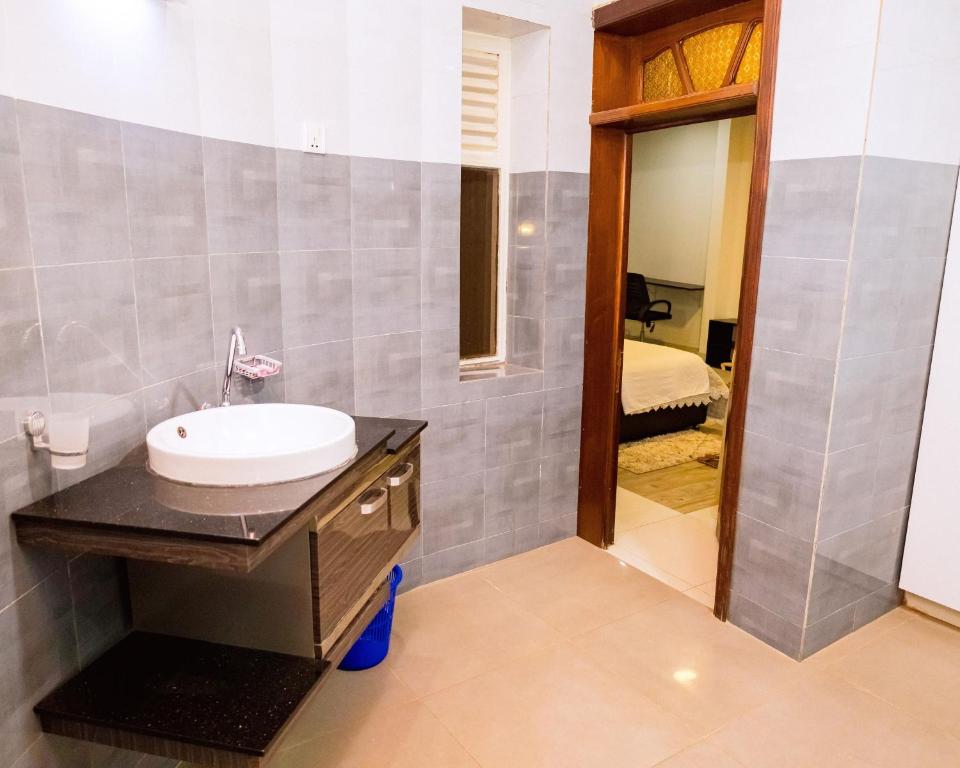 Bathroom vanity with vessel basin opening onto the bedroom