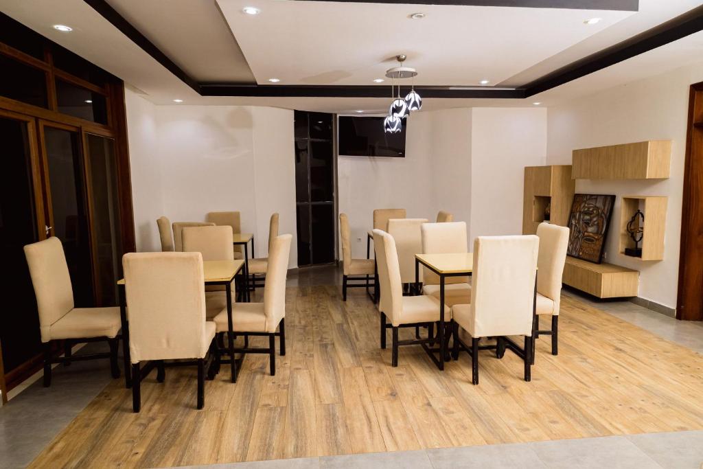 Restaurant dining room with set tables and high-backed chairs
