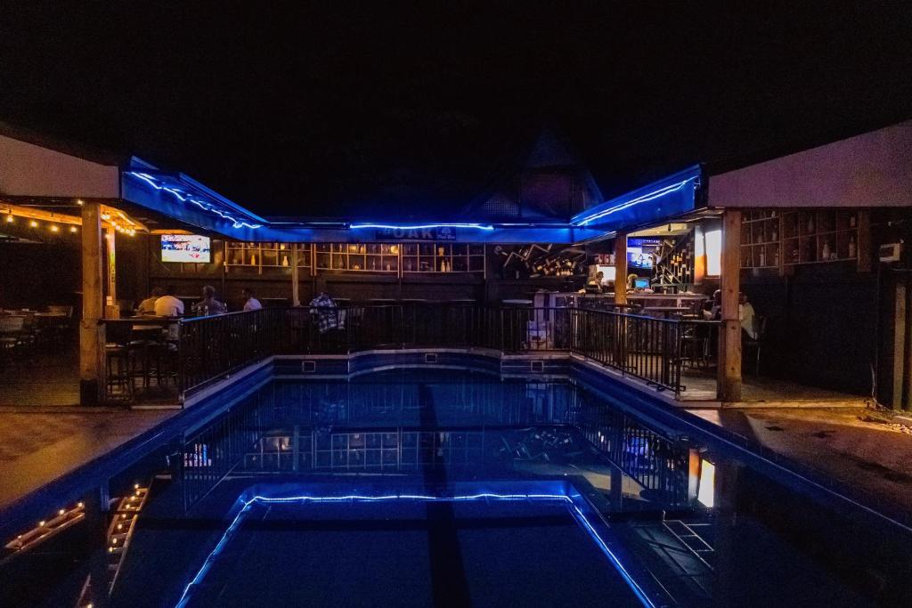The pool lit with blue neon at night