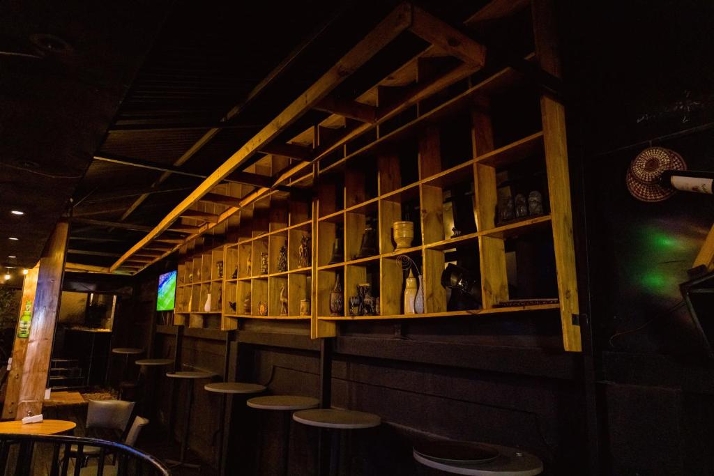 The Oak bar shelving and stools after dark