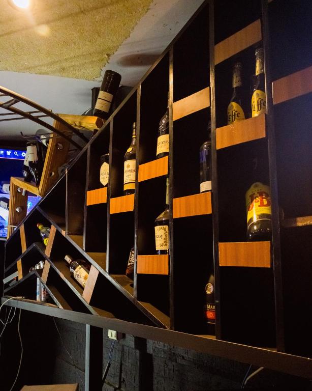 Angular bottle shelving behind the bar