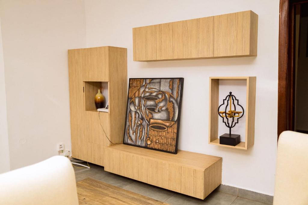 Lounge console with framed artwork and sculpture niches
