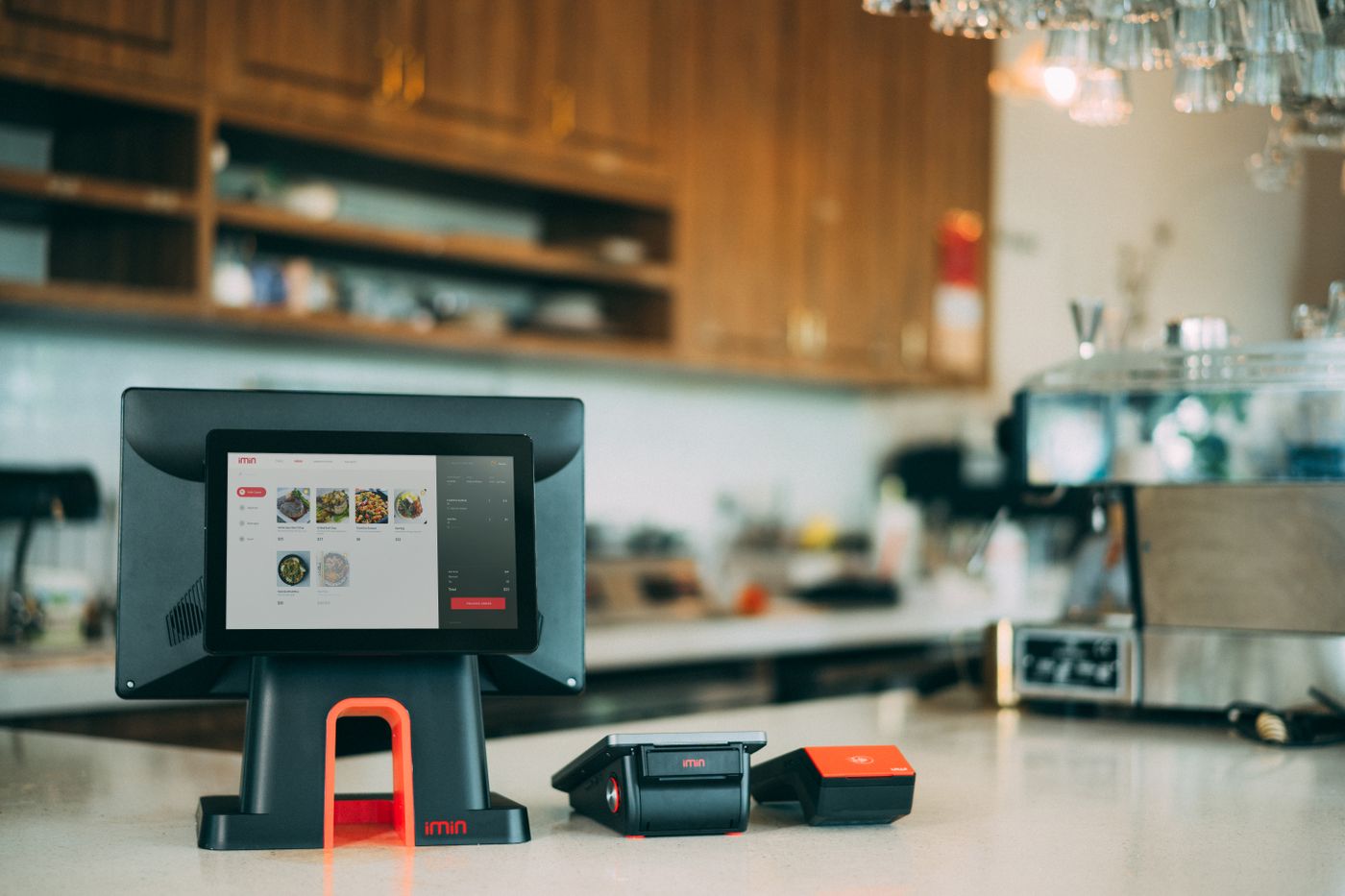 Touchscreen point-of-sale terminal and thermal receipt printer on a cafe counter